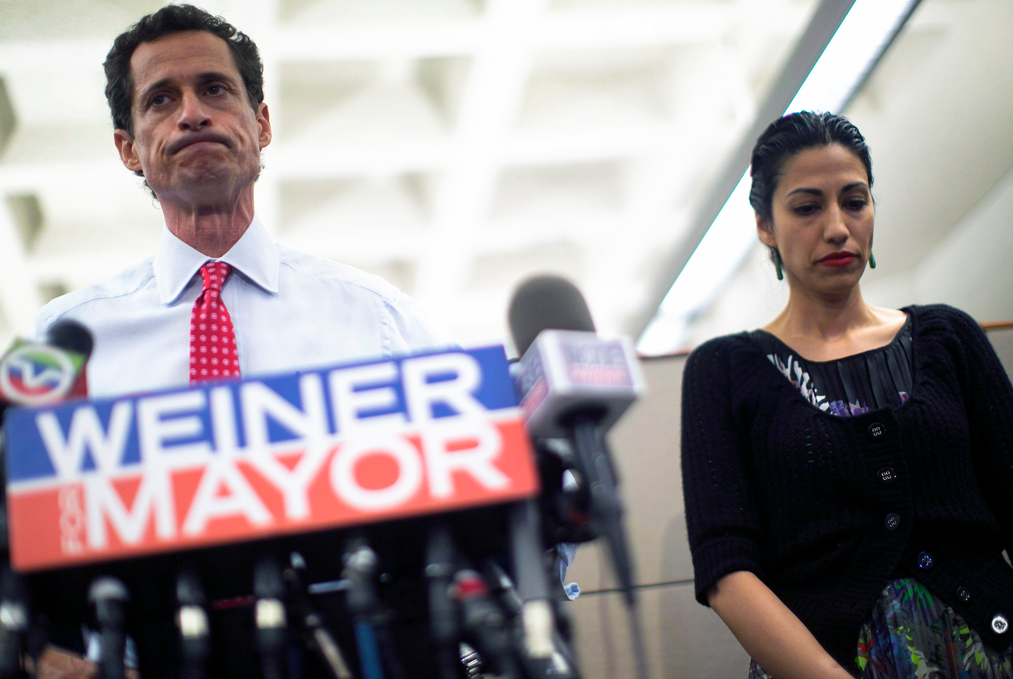 A chastened Anthony Weiner and his humiliated but surprisingly still supportive wife Uma Abedin appear at a press conference.
