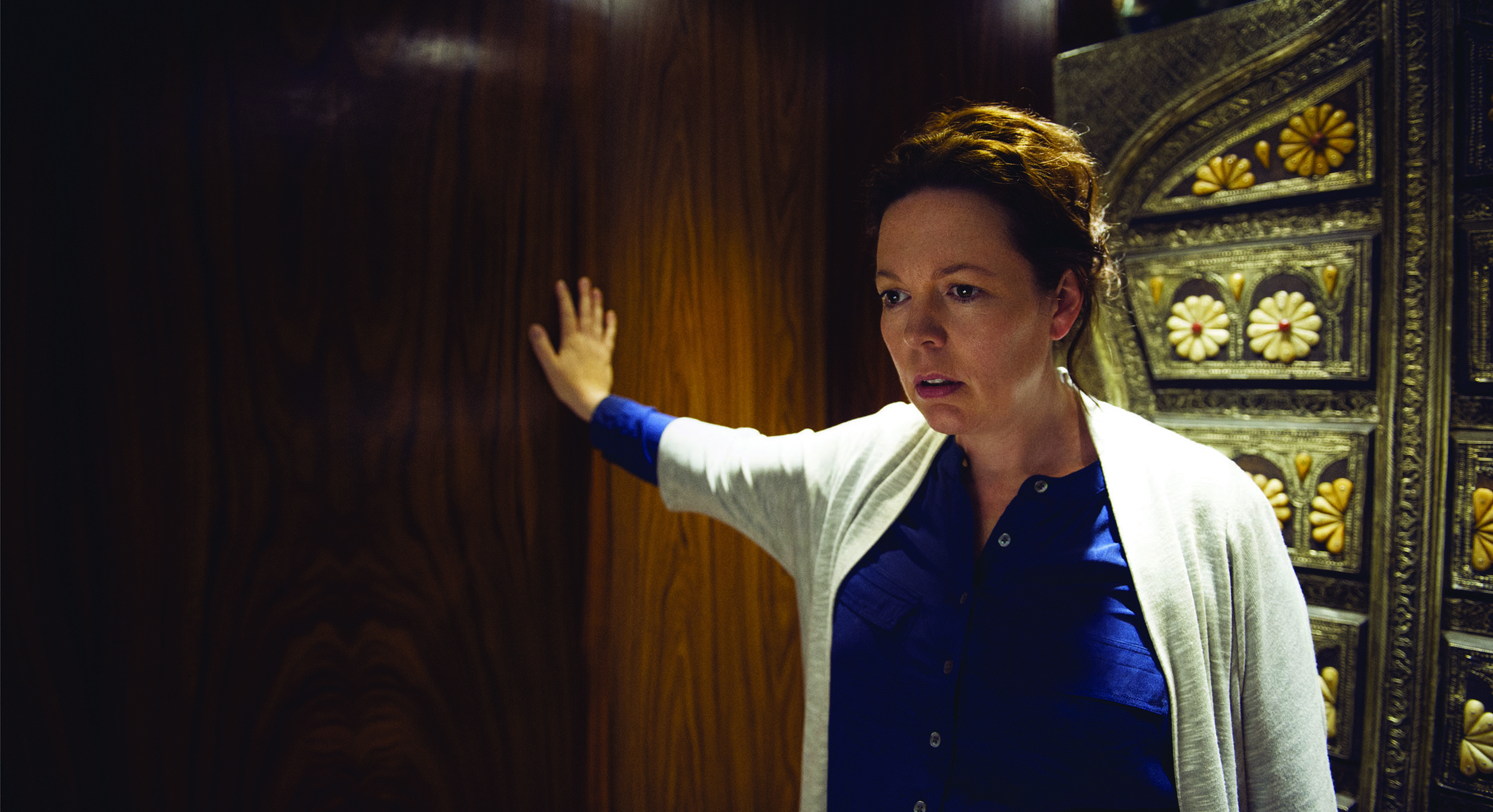 Olivia Colman as British Special Intelligence Service agent Angela Burr.