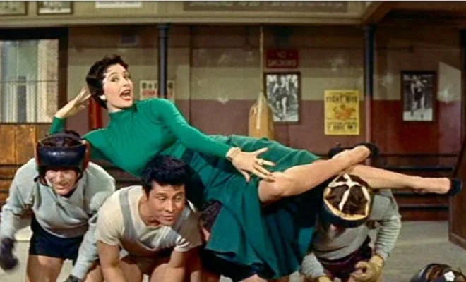Cyd Charisse is the center of attention in the “Baby, You Knock Me Out” dance routine .