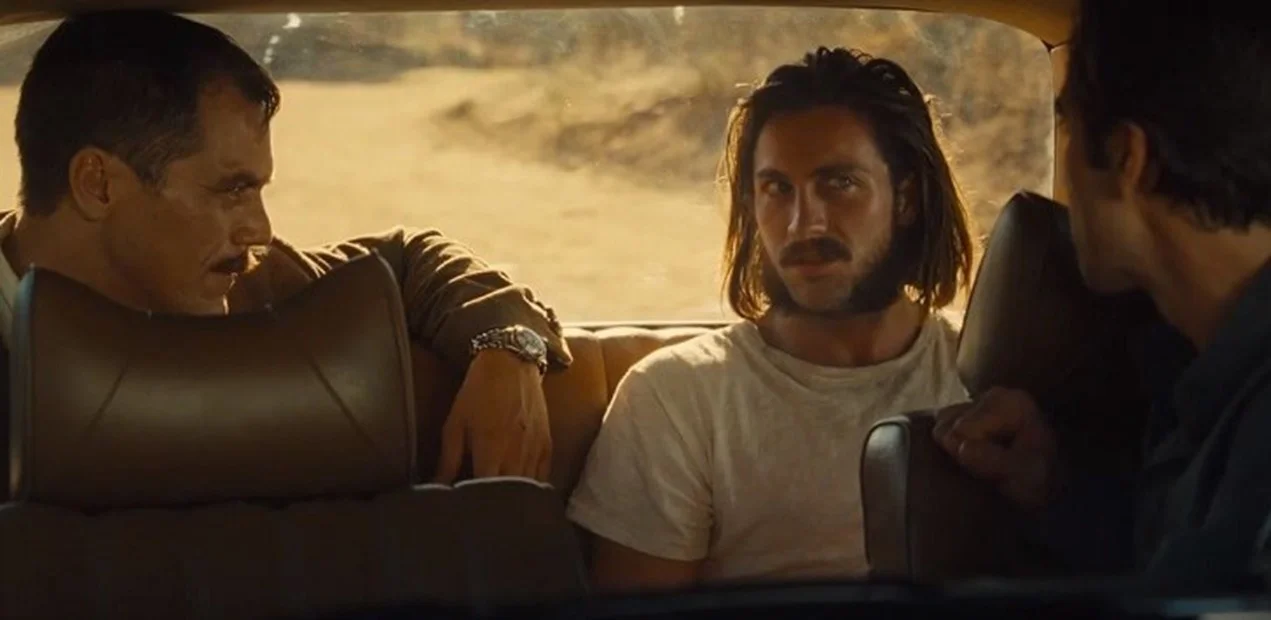 The hunter gets captured by the game: a propensity for violence unites Sherriff Andes (Michael Shannon) and his quarry, Ray (Aaron Taylor-Johnson).