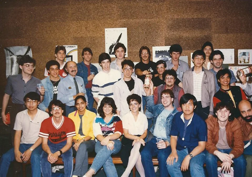 A "minicourse" class at Brooklyn Poly, 1995. Note the bottles of Stoli held by a couple of students. The author appears in the 2nd row, 3rd from left.