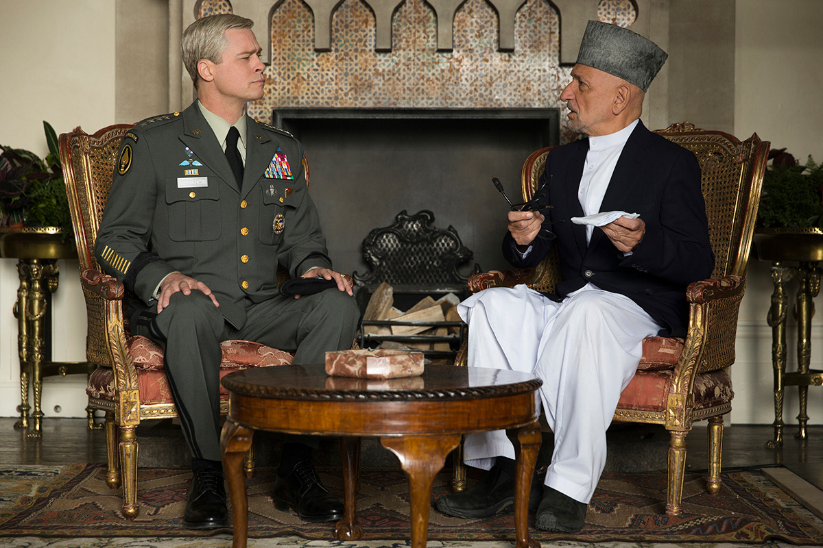 General Glen McMahon (Brad Pitt) explains to the Afghan President (Ben Kingsley) the U.S. military's planned "new direction" for the conflict in his country.