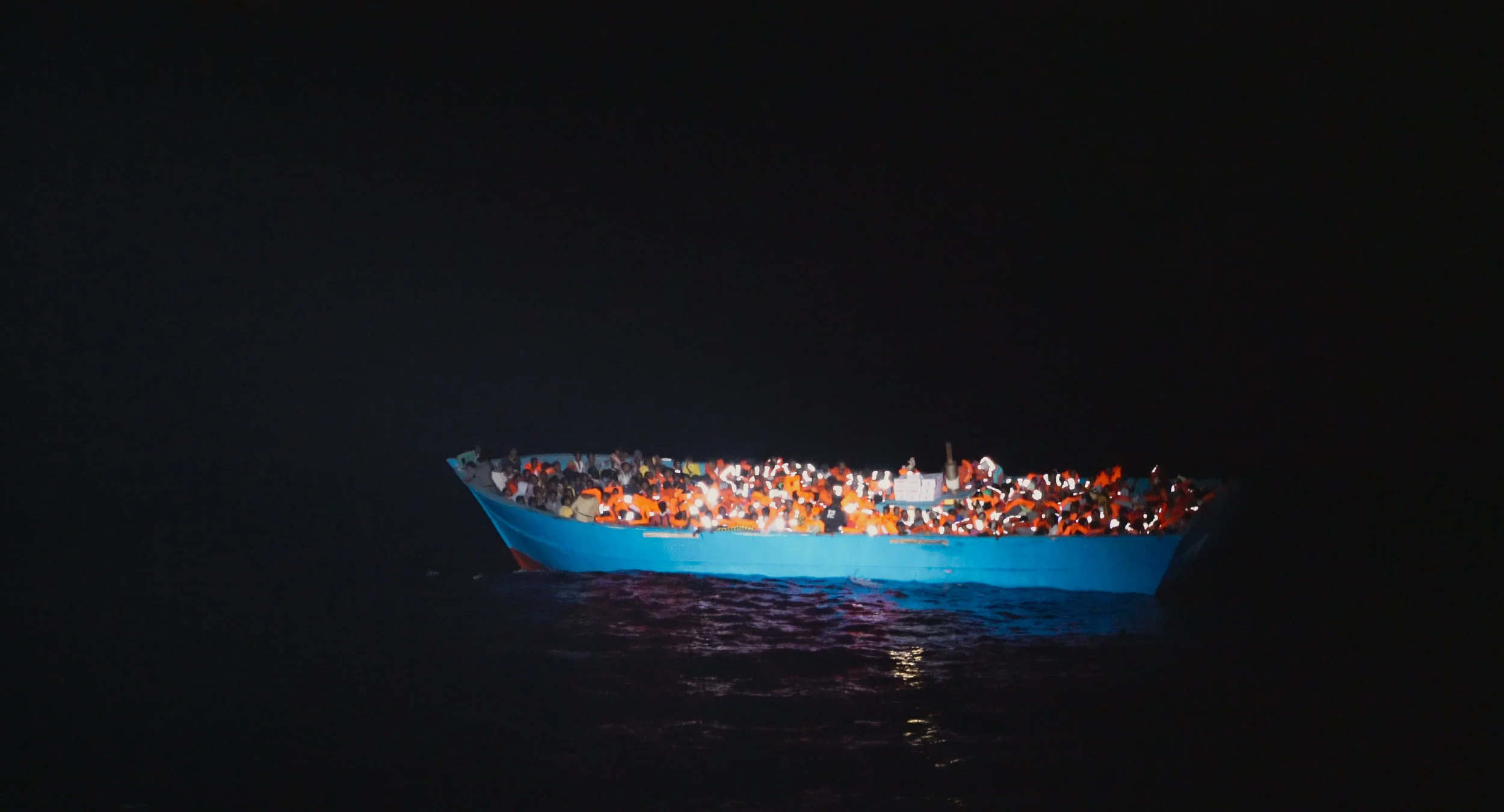 A refugee boat crossing the Mediterranean Sea.