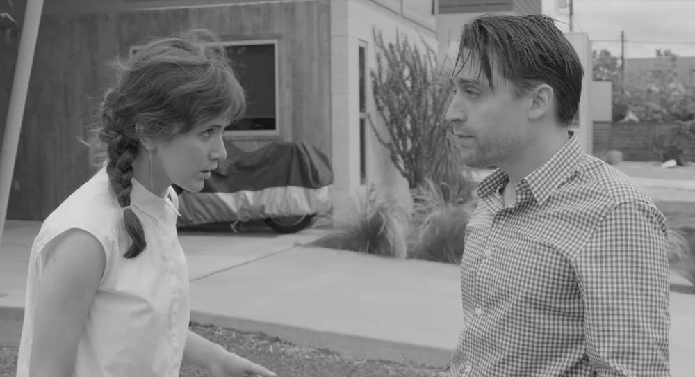 Emotionally infantile himself, Ben (Kieran Culkin, with Trieste Kelly Dunn) schemes to provide ageless babies for needy parents in Infinity Baby (2017).