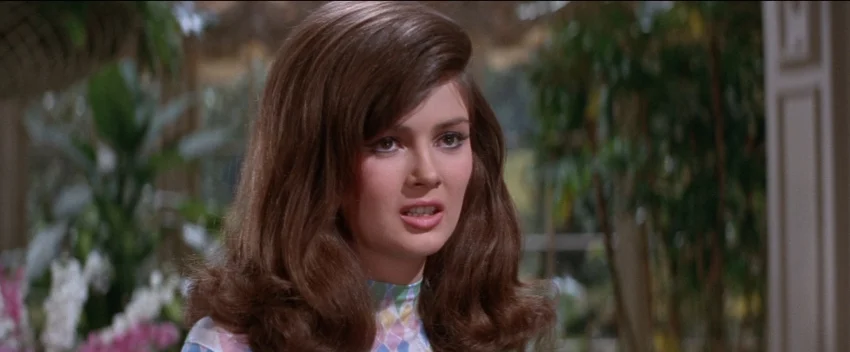 Miranda Sampson (Pamela Tiffin) is traditional Noir source of romantic intrigue in Harper .