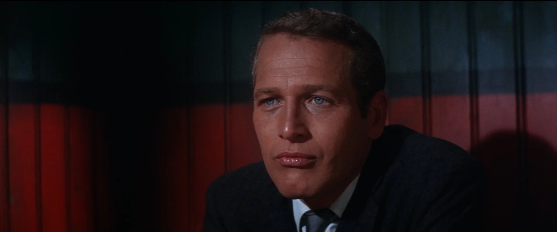 Lew Harper (Paul Newman) ponders one of the many criminal mysteries that occur during Harper and The Drowning Pool .