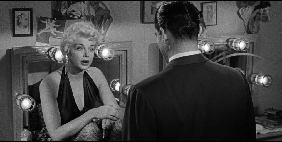 Like the audience, stripper Dolly Moore (Barbara Nichols) doesn't know who she's dealing with in Beyond a Reasonable Doubt.