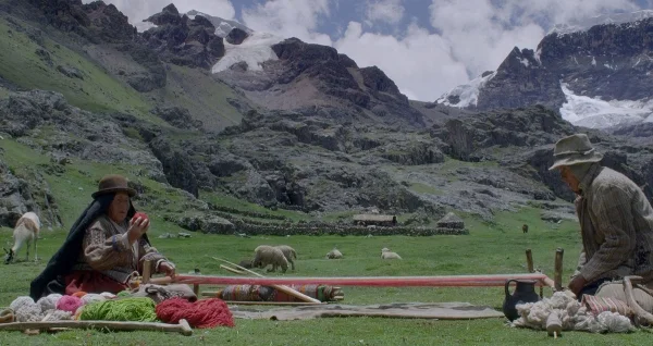 An octagenarian Aymara couple weaves in the Peruvian Andes in Wiñaypacha .