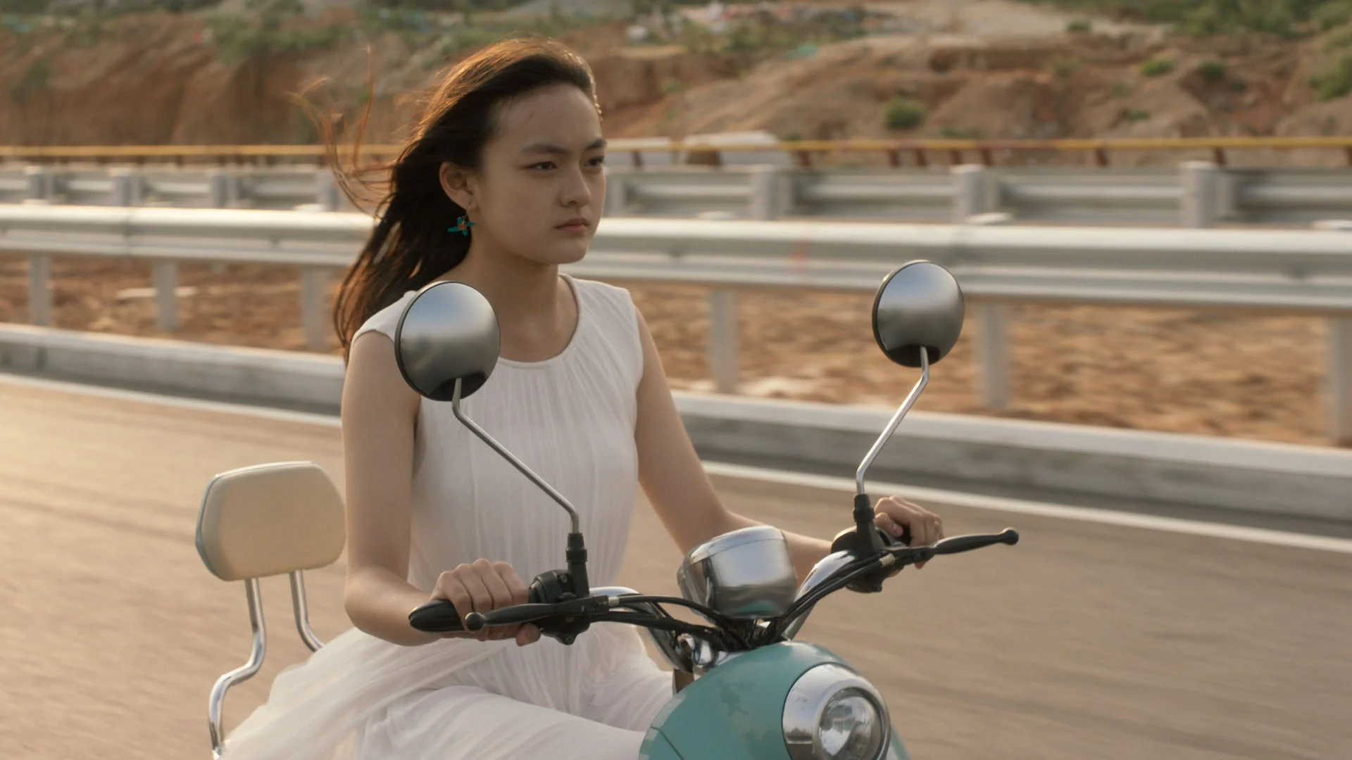 Mia (Qi Wen) rides a stolen motorbike toward an unknown future.