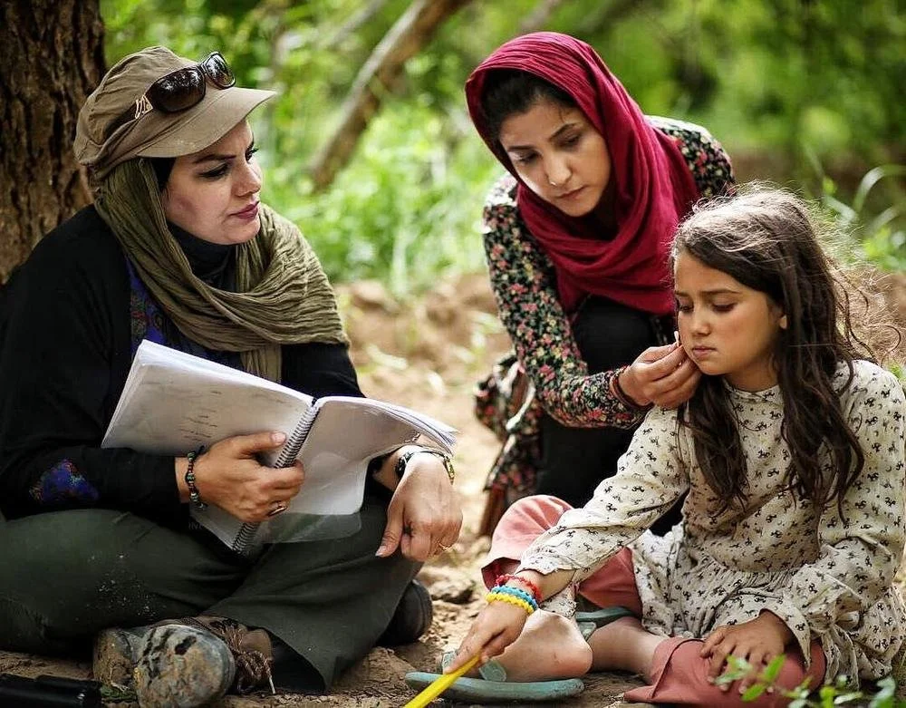 Abyar pictured with the women and children of the historic town of Yazd, a city she recognizes as her hometown.