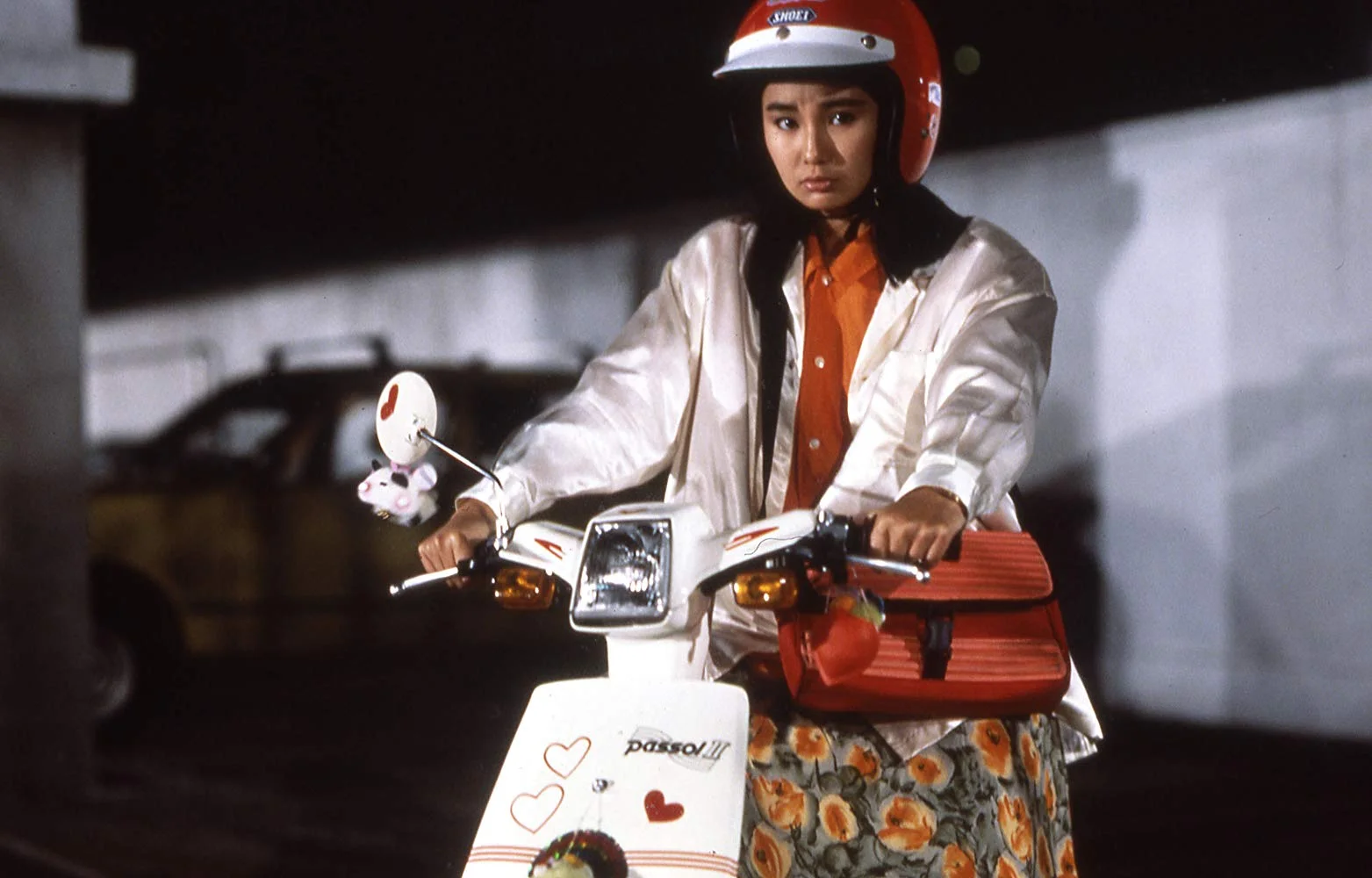 Maggie Cheung as May, Inspector Chan’s girlfriend.