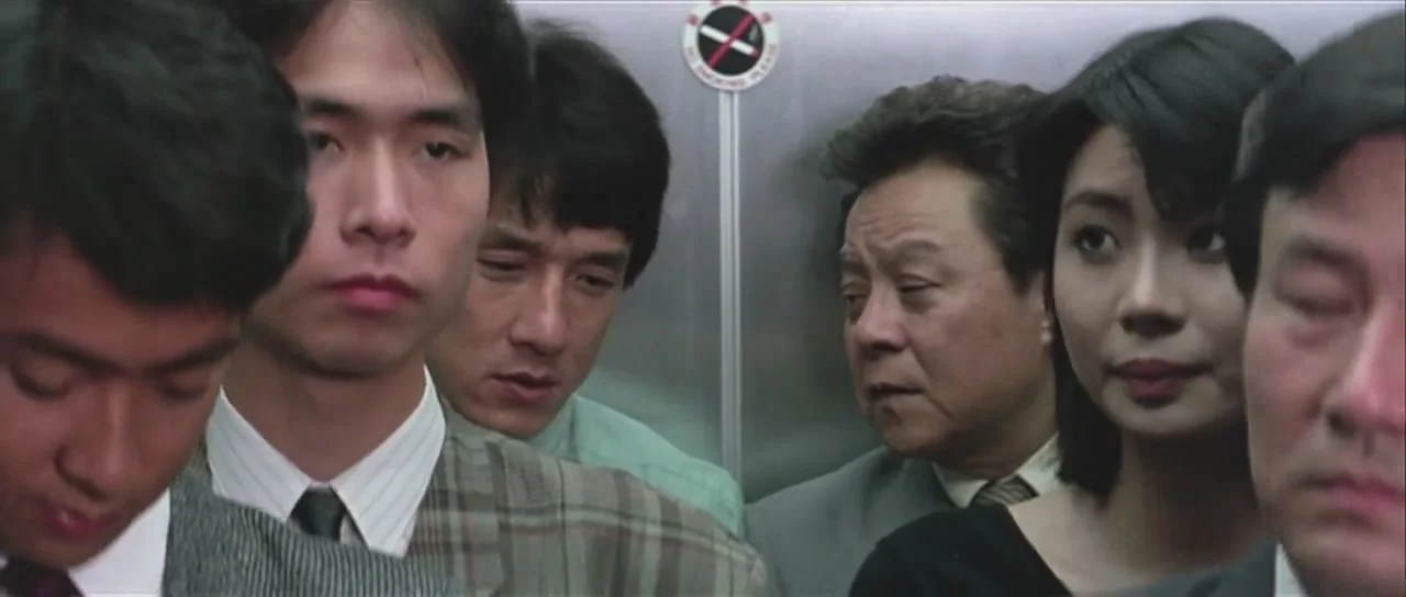 Chan talks with his fellow Inspector Uncle Bill Wong (Bill Tung).