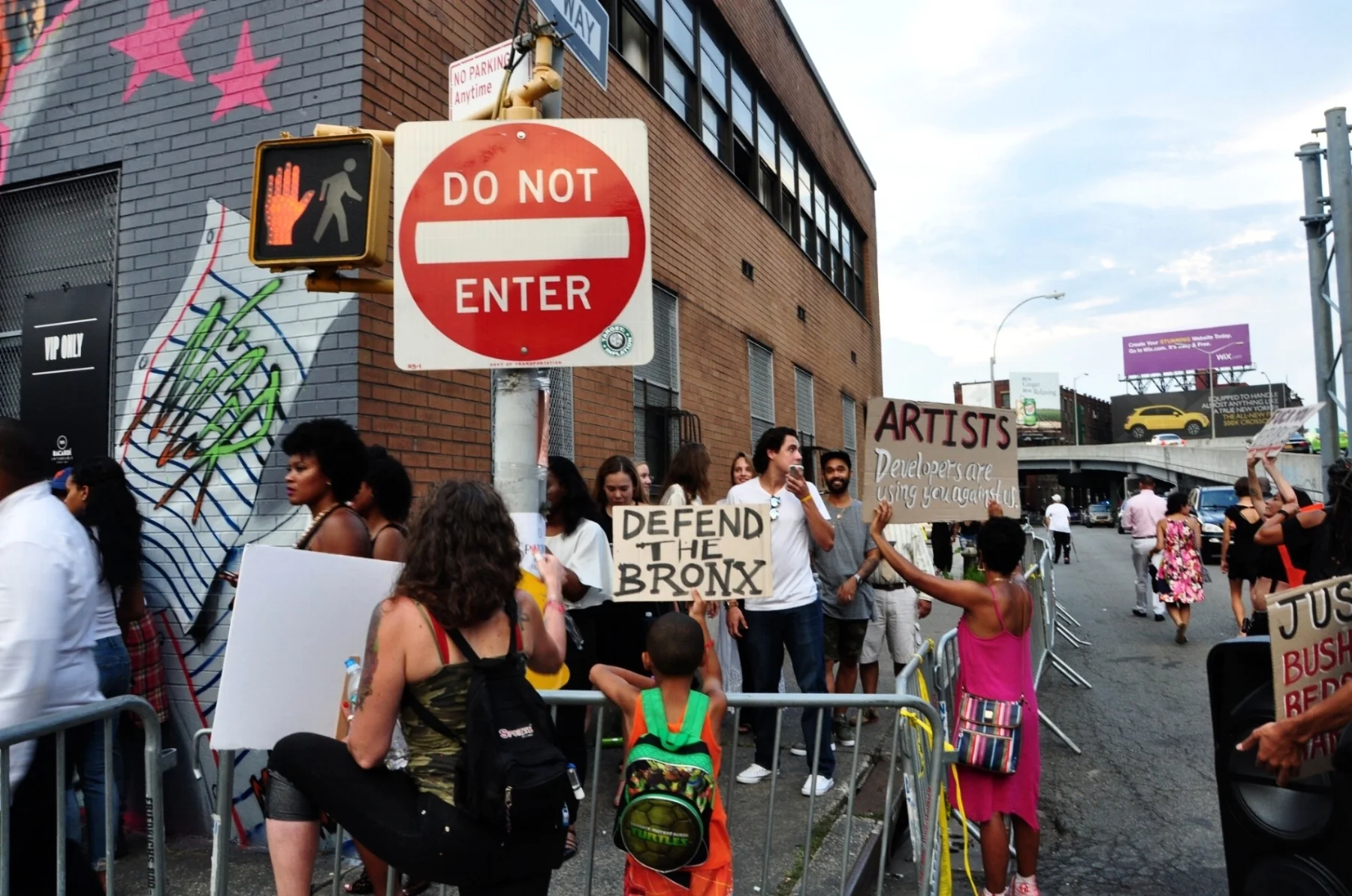 By Samali Bikangaga. Protesters rally outside 101 Lincoln Ave. to denounce the show