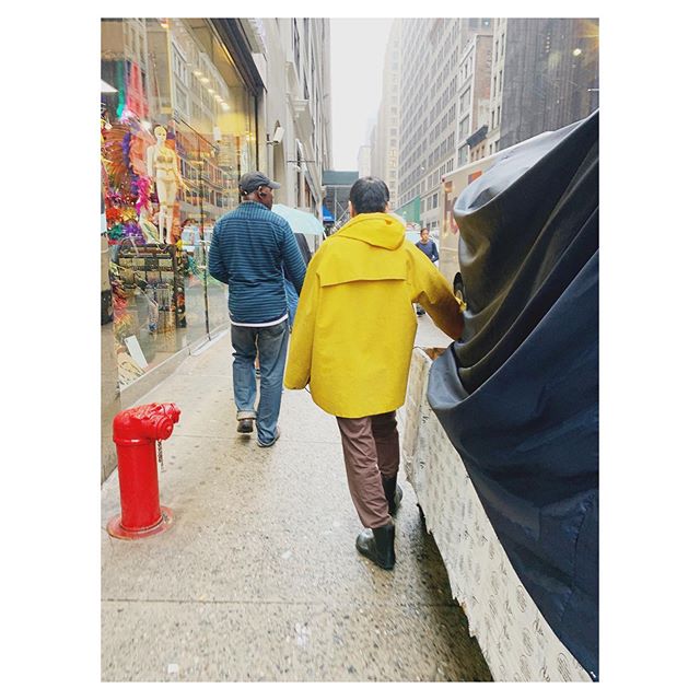 LOVING this delivery man&rsquo;s lewk. Yellow raincoat, relaxed wool slacks, rubber boots