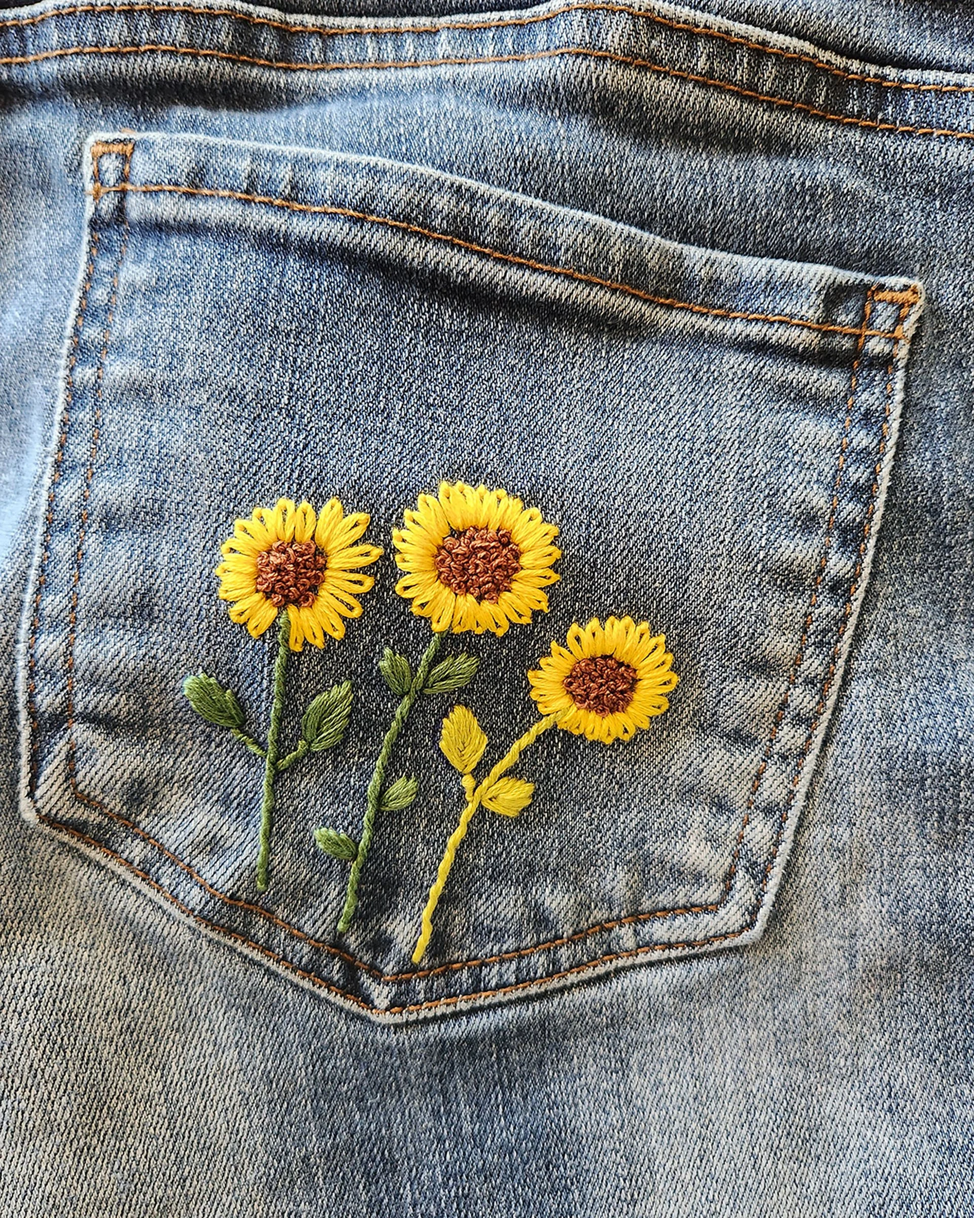 Veronica embroider your denim sunflowers.jpg