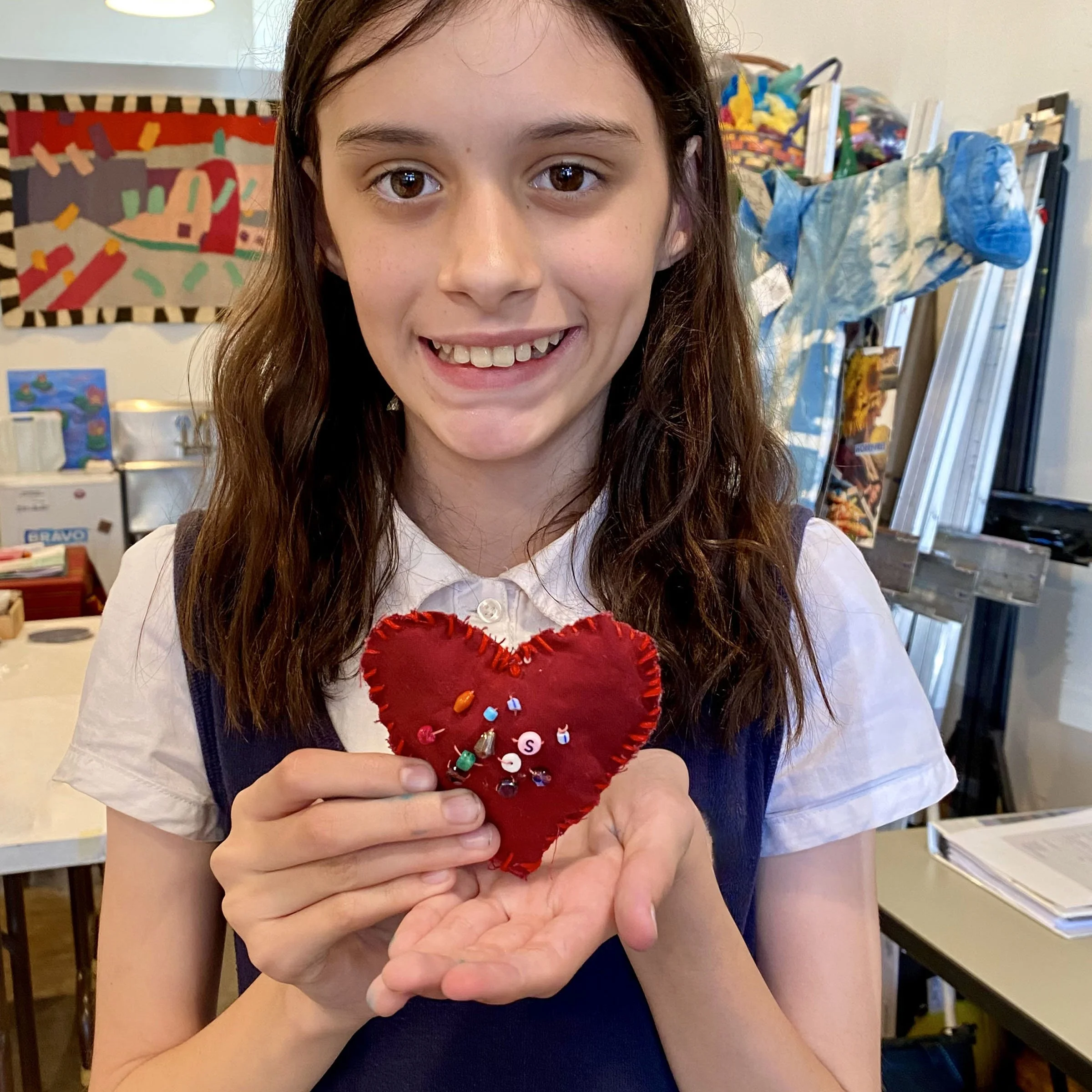 IMG_0552 S and her stitched and beaded heart.jpeg
