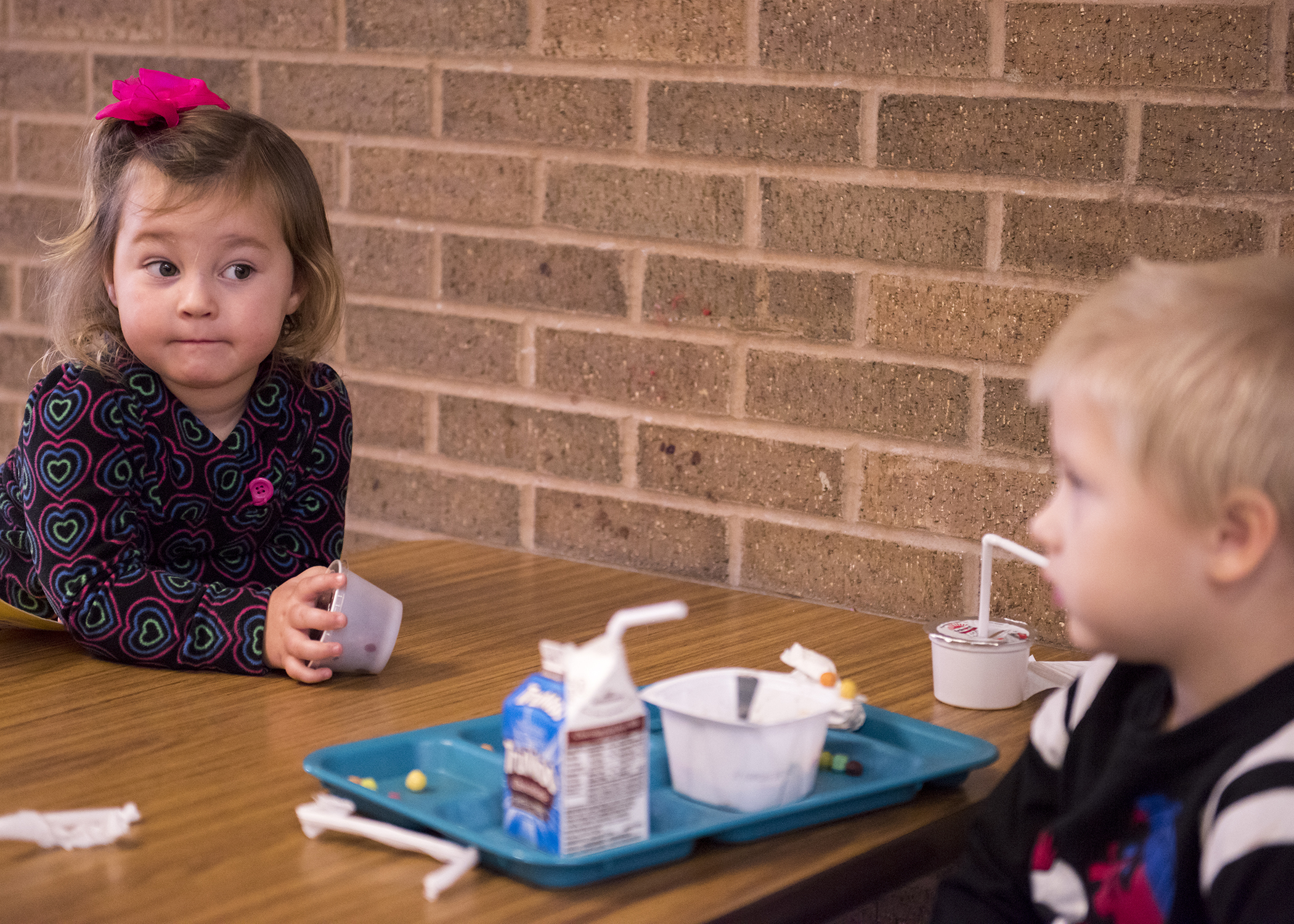 Emily Stack (left) and Karsen Barringer (right) interact with each other during lunch.