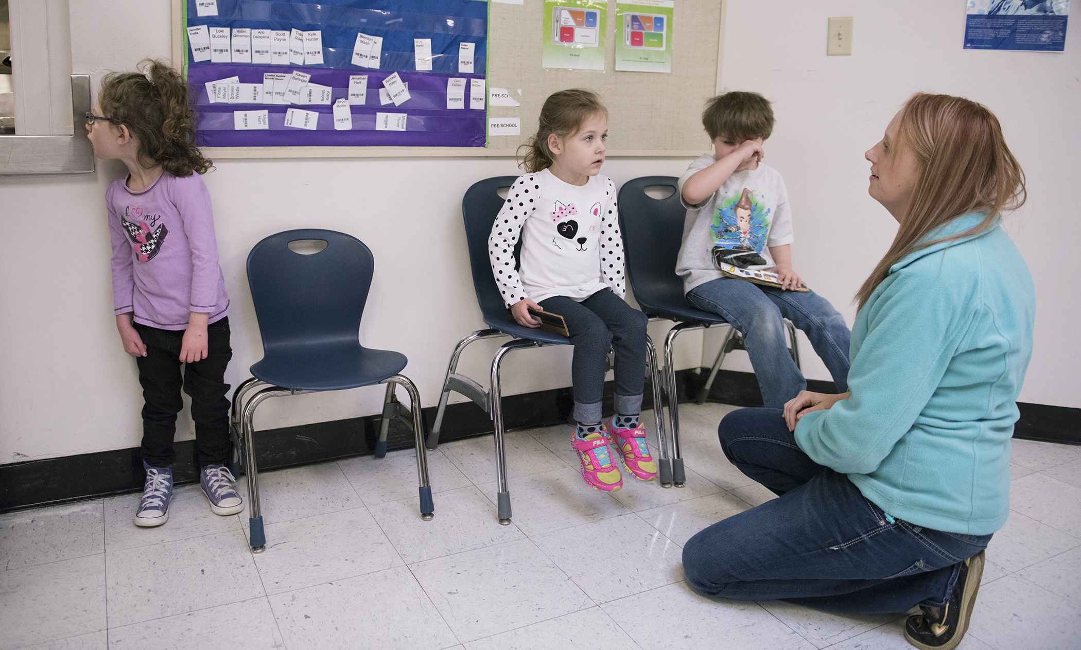 (From left to right) Fiona Meyer, Allie Jolley and Behnjamin McKinney-Collins all line up for lunch while Alania Harper talks to them.