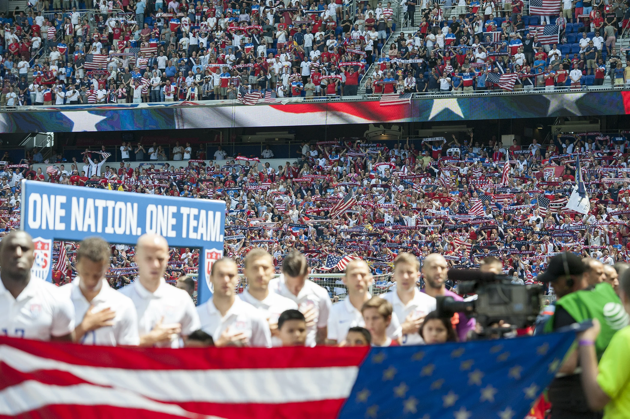 The American Outlaws raise scarves during the United States national anthem before their international friendly against Turkey at Red Bull Arena in Harrison, New Jersey on June 1, 2014.