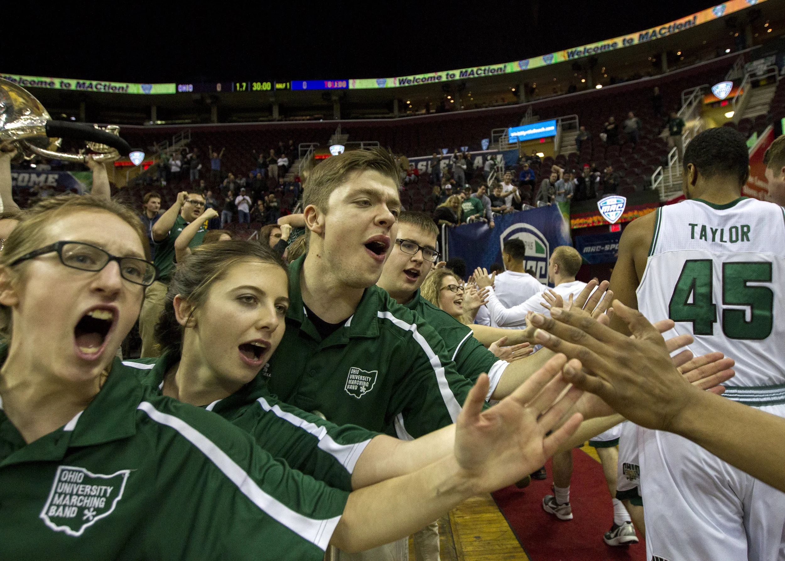 Members of the Ohio University Marching 110 cheer on the men's basketball team after their thrilling 67-66 comeback win over Toledo in the semifinals of the MAC Tournament on March 9, 2017 at Quicken Loans Arena in Cleveland, Ohio.