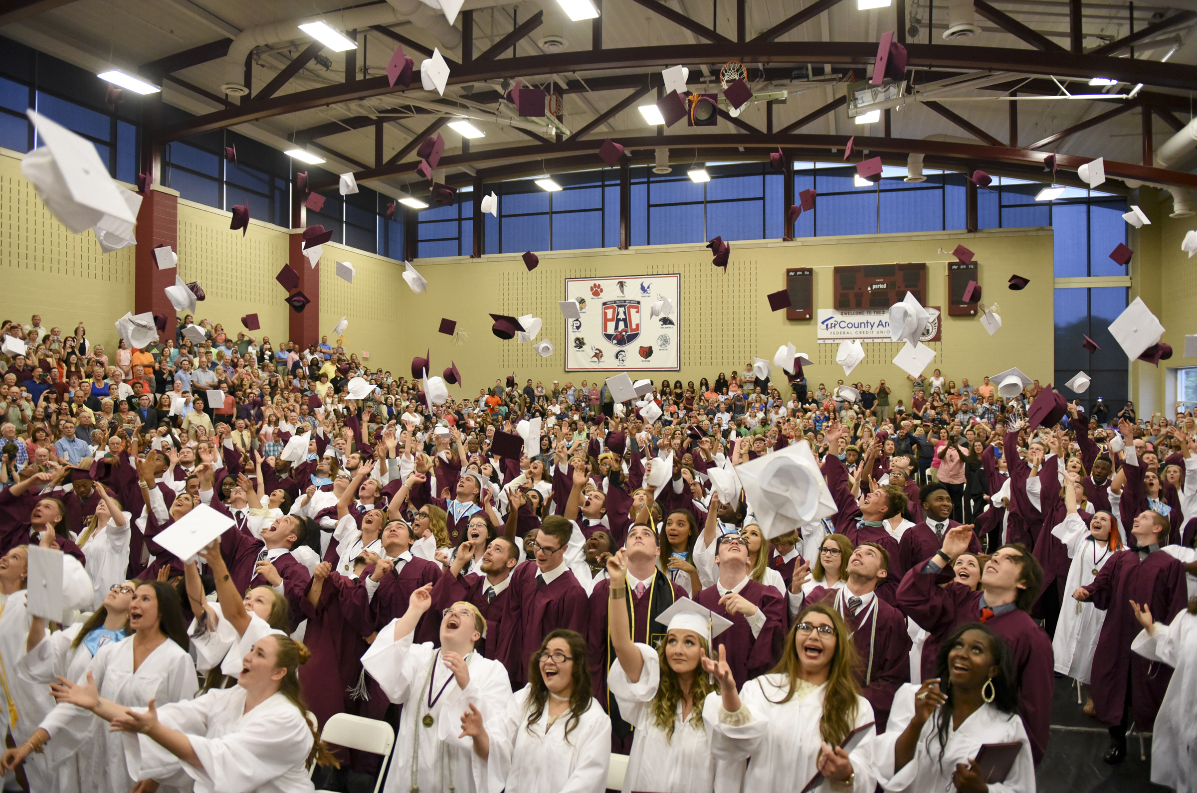 The Pottsgrove High School Class of 2017 throws their caps in the air after turning their tassels at their commencement ceremony on June 16, 2017.