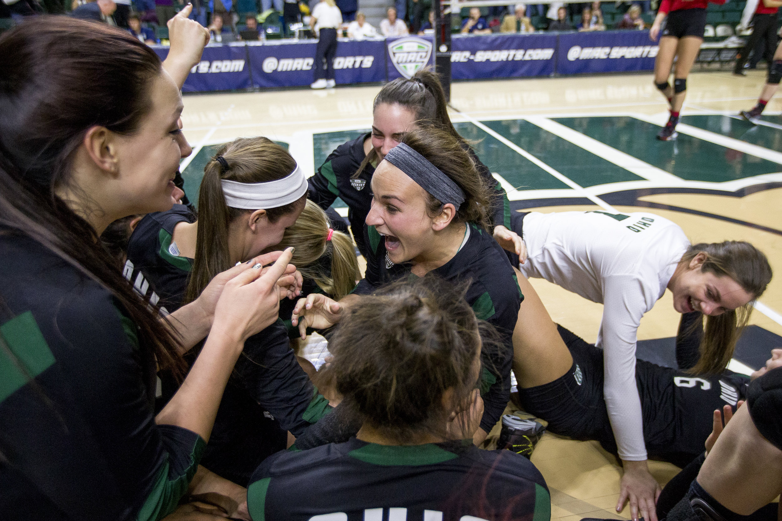Ohio senior setter Abby Gilleland (center) celebrates with her teammates after sweeping the #1 seeded Northern Illinois 3-0 to win the 2015 MAC Women's Volleyball Championship at the Convocation Center in Athens, Ohio on November 22, 2015.