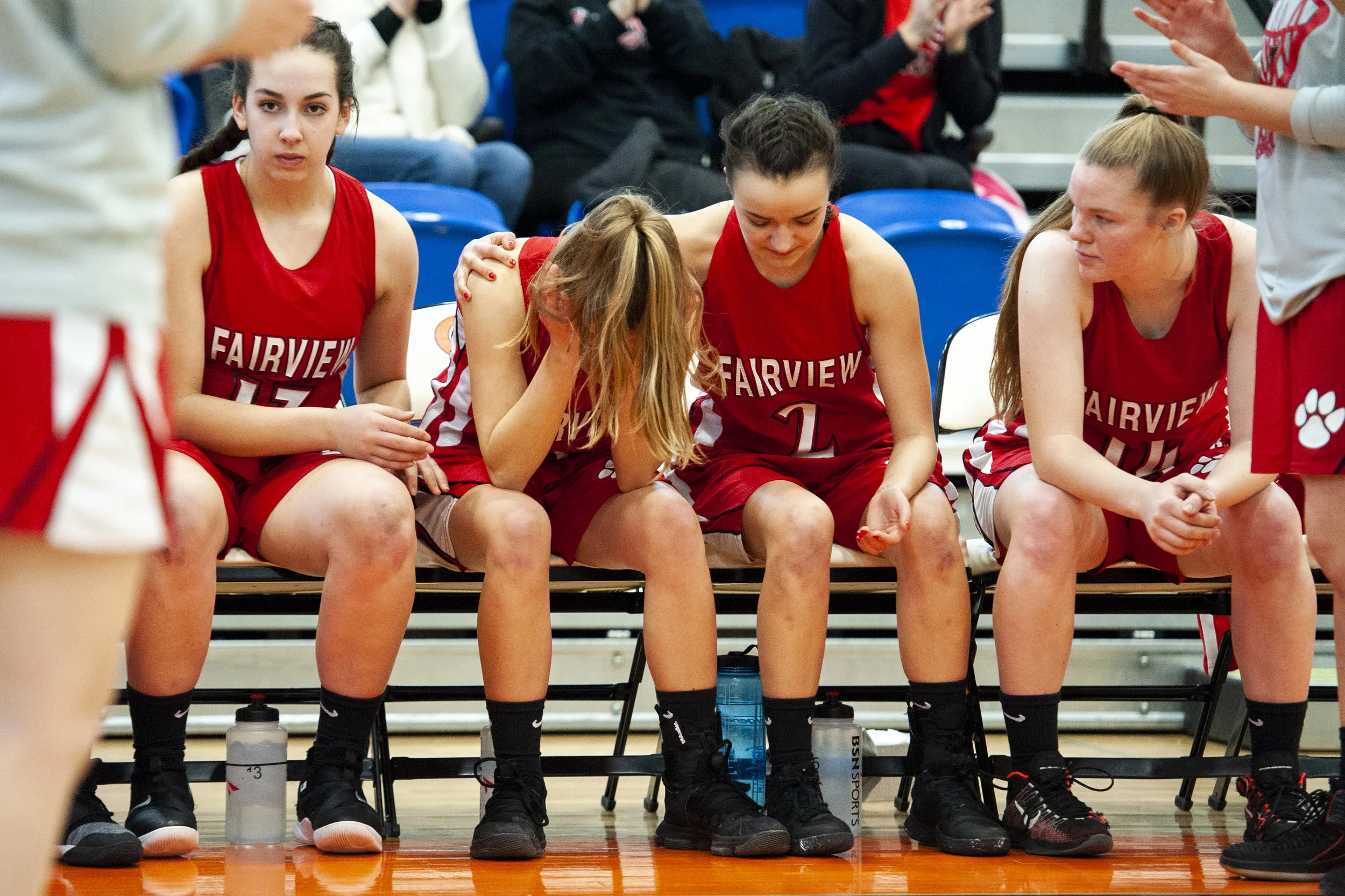 Fairview senior guard Ashley McCall (center) is consoled by teammates Georgia Nicewonger (right) and Samantha Momeyer (left) before the start of the Tigers’ game against Mercyhurst Prep in the District 10 Championship game. The McCall’s grandfather passed away in a car accident just days before the game.
