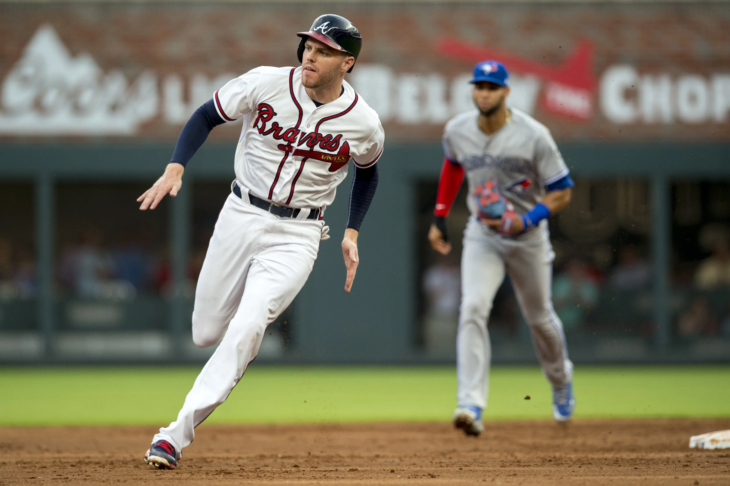   Freddie Freeman #5 of the Atlanta Braves runs to third base against the Toronto Blue Jays at SunTrust Park on July 11, 2018, in Atlanta, Georgia. The Braves won 9-5. (Photo by Carl Fonticella/Beam Imagination/Atlanta Braves/Getty Images) 