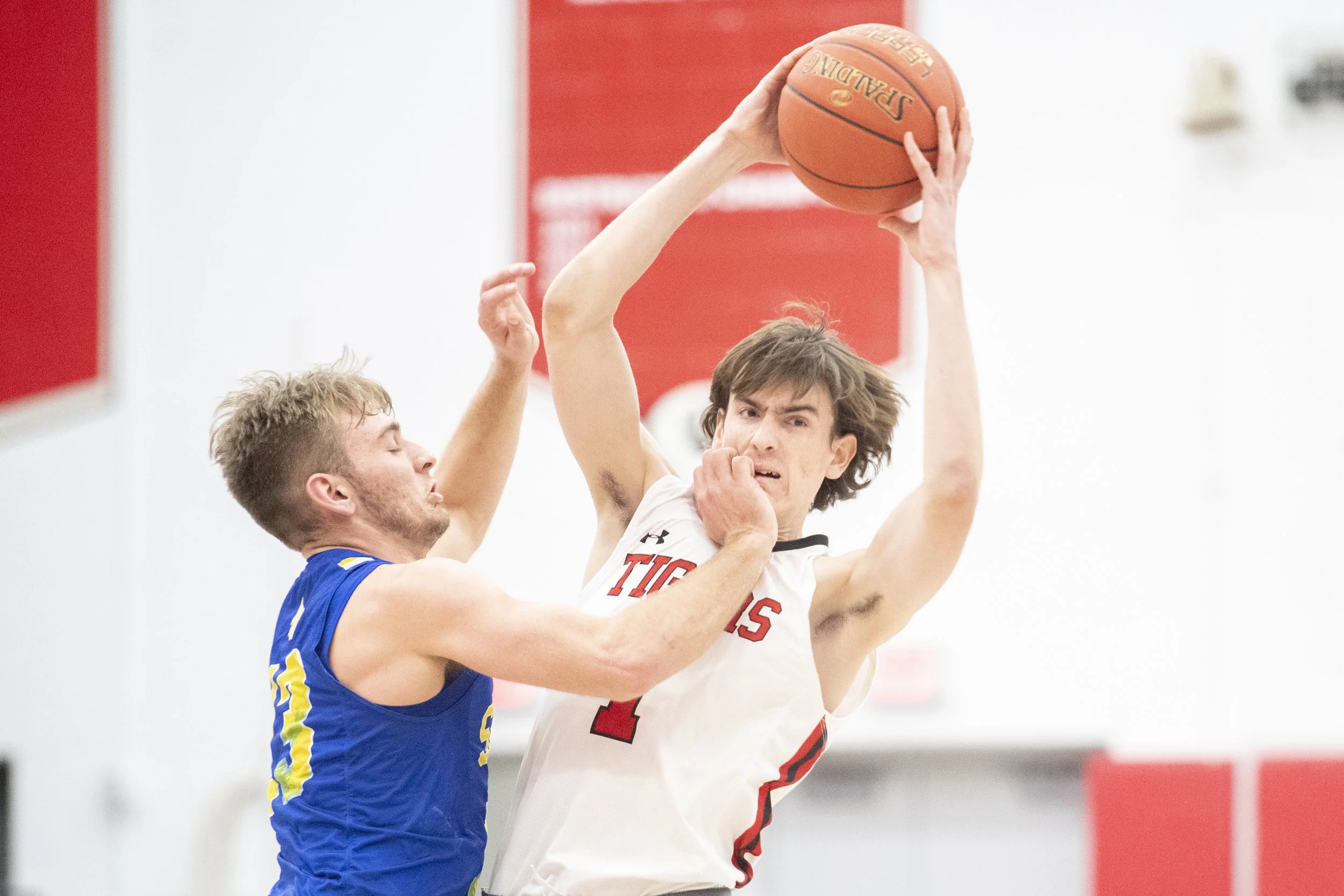 Fairview senior forward Patrick Stafford receives contact from Seneca senior guard Nolan Seabury in the second half of the Tigers’ 53-41 win over the Bobcats on January 26, 2024.