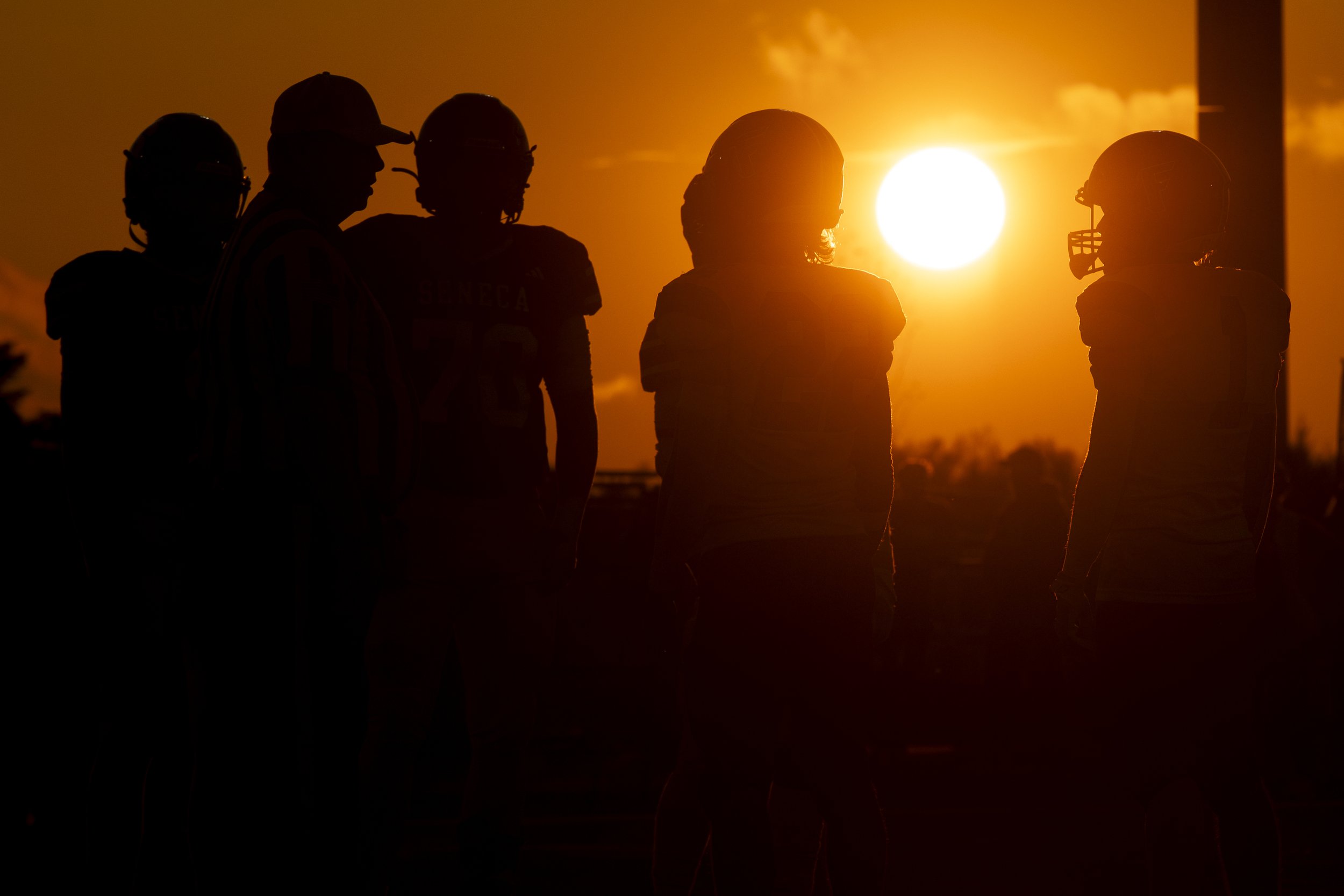  The sunset shines on the captains of Fairview and Seneca before the coin toss on September 25, 2025 at Bob Diffenbacher Field in Wattsburg, PA. 