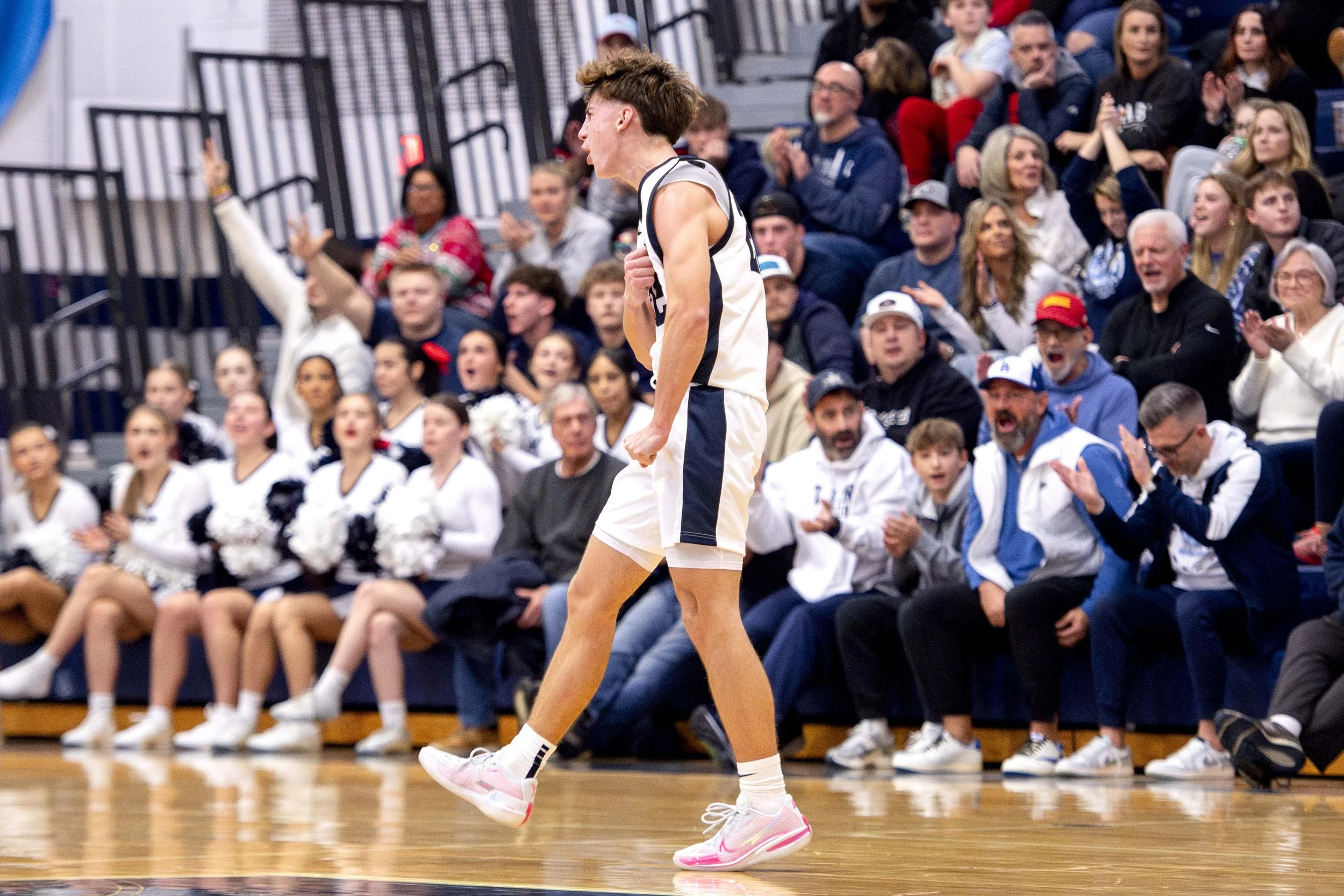  McDowell junior guard Landon Marsh (#22) celebrates after a three-pointer made against Harbor Creek in the second quarter of their 78-43 win on December 12, 2025. 