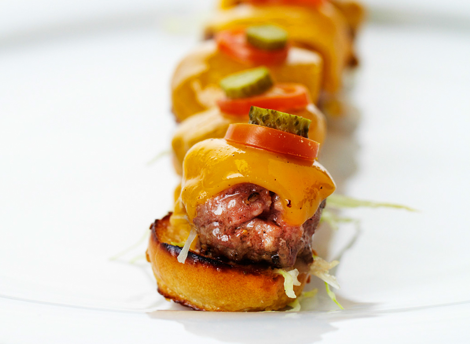   Mini Kobe Cheeseburgers with Remoulade and Aged Cheddar  