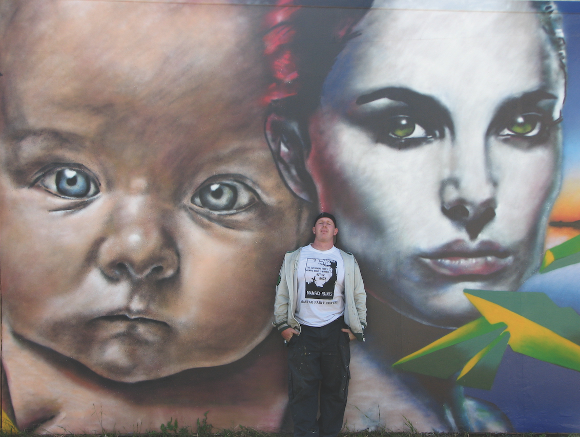 Mark Taylor and his mural Child.