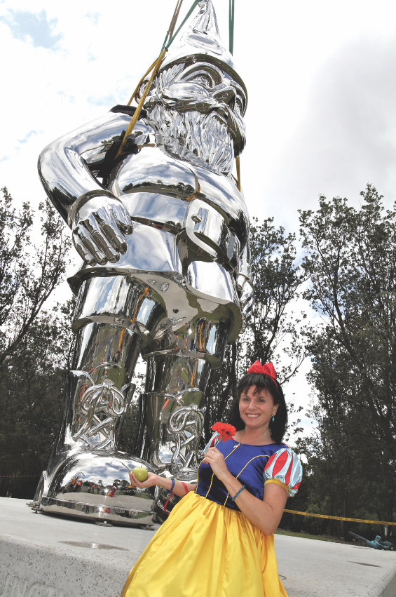 Frankie is welcomed back to Frankston with an apple, a flower and a smile from Mayor Sandra Mayer.