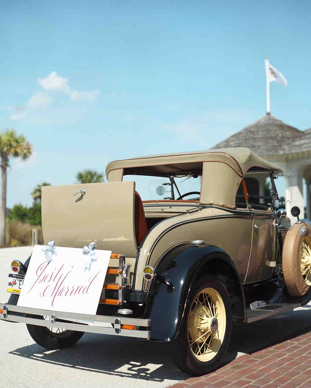 CALLIGRAPHED "JUST MARRIED" SIGN A vintage getaway car goes great with some classic calligraphy. Photography: Adrienne Page