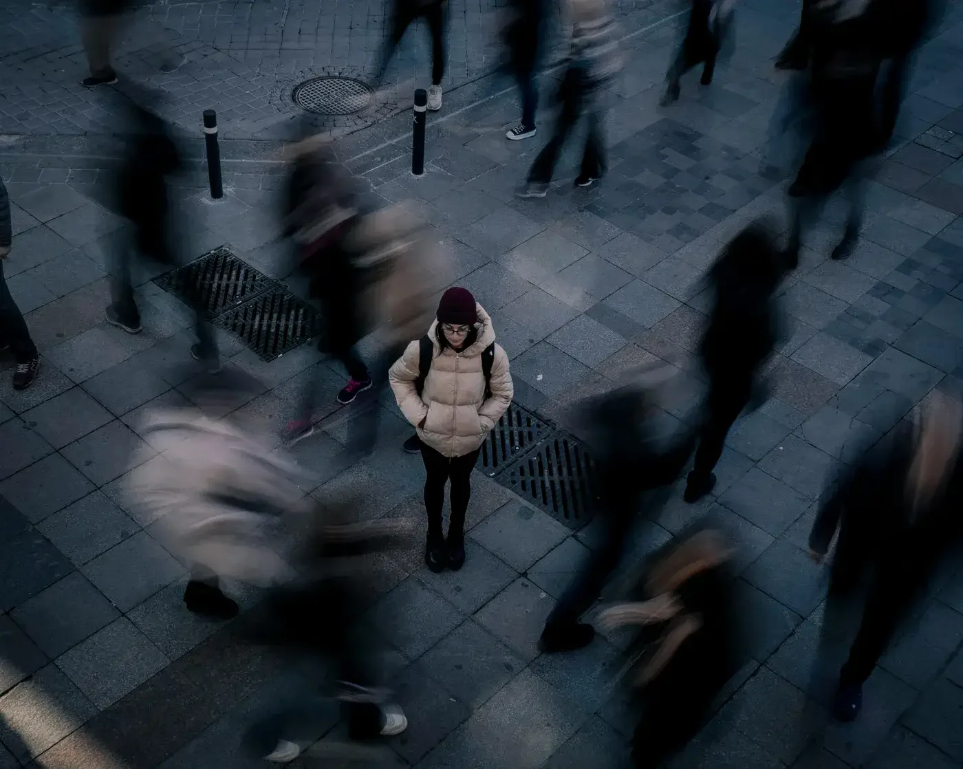 Woman Standing Alone in Crowd