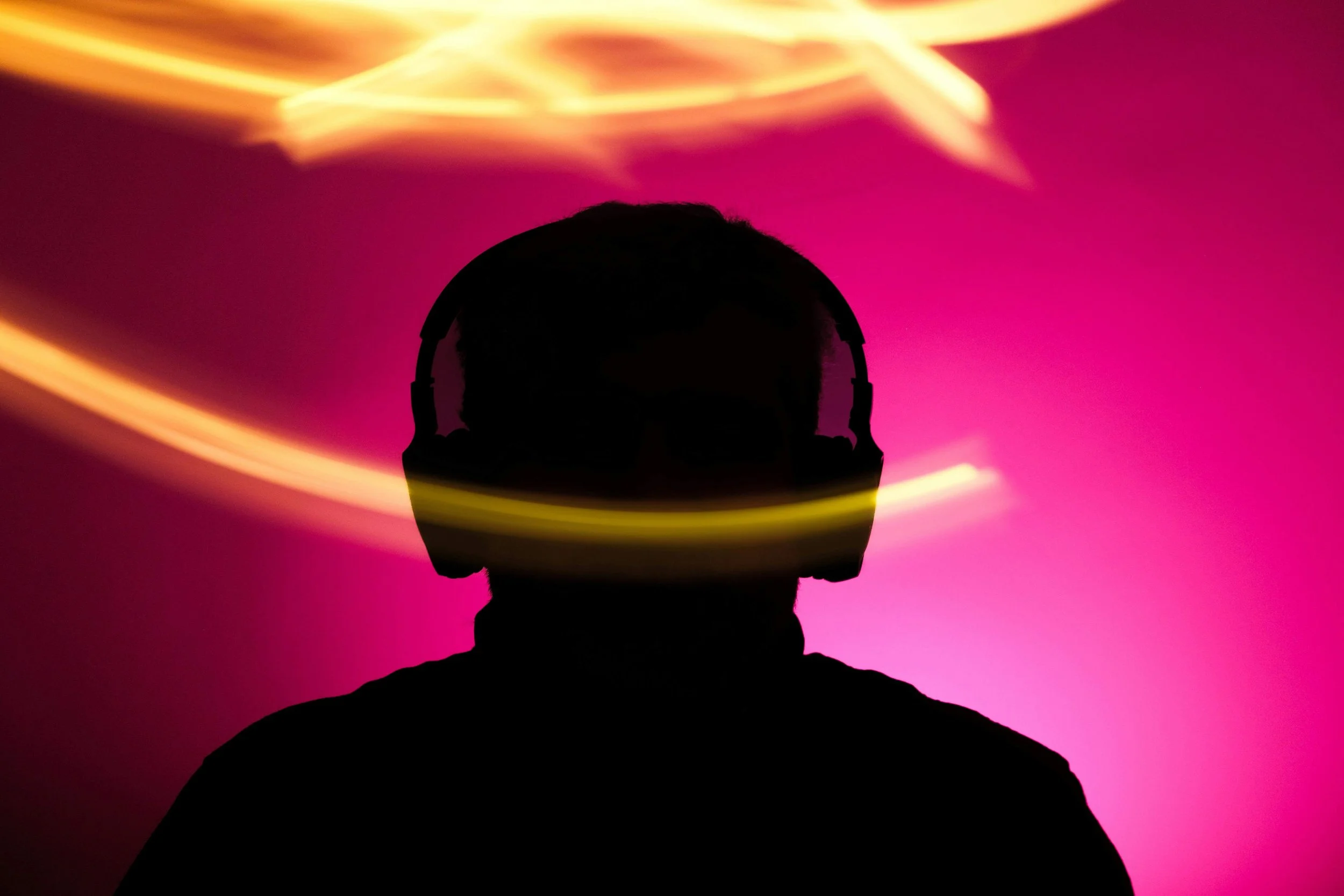 Silhouette with Headphones and Light Streaks