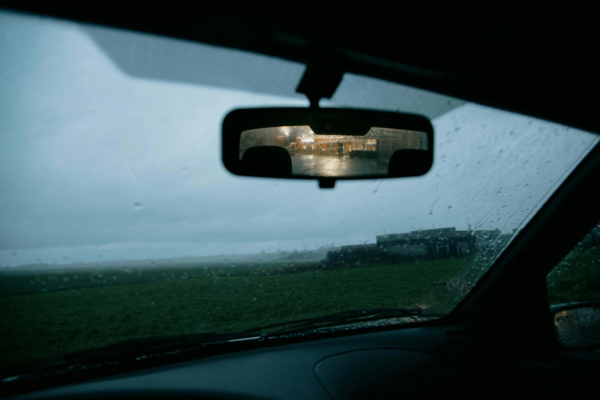 Through windshield of car on rainy nature