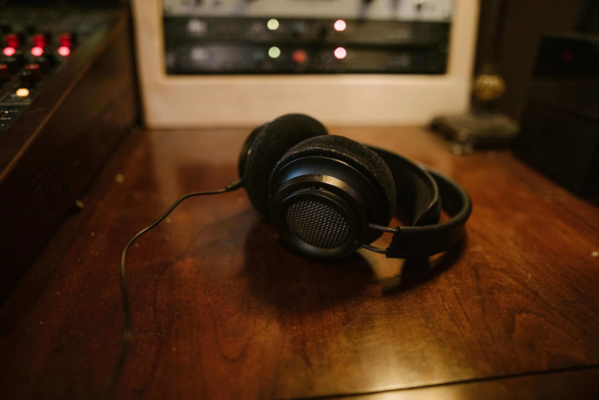 Black Headphones on Wooden Table