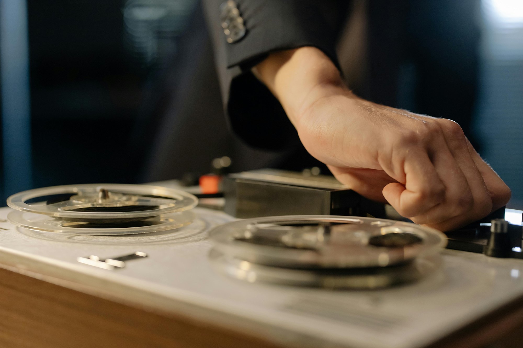 A Person Operating a Tape Recording Machine
