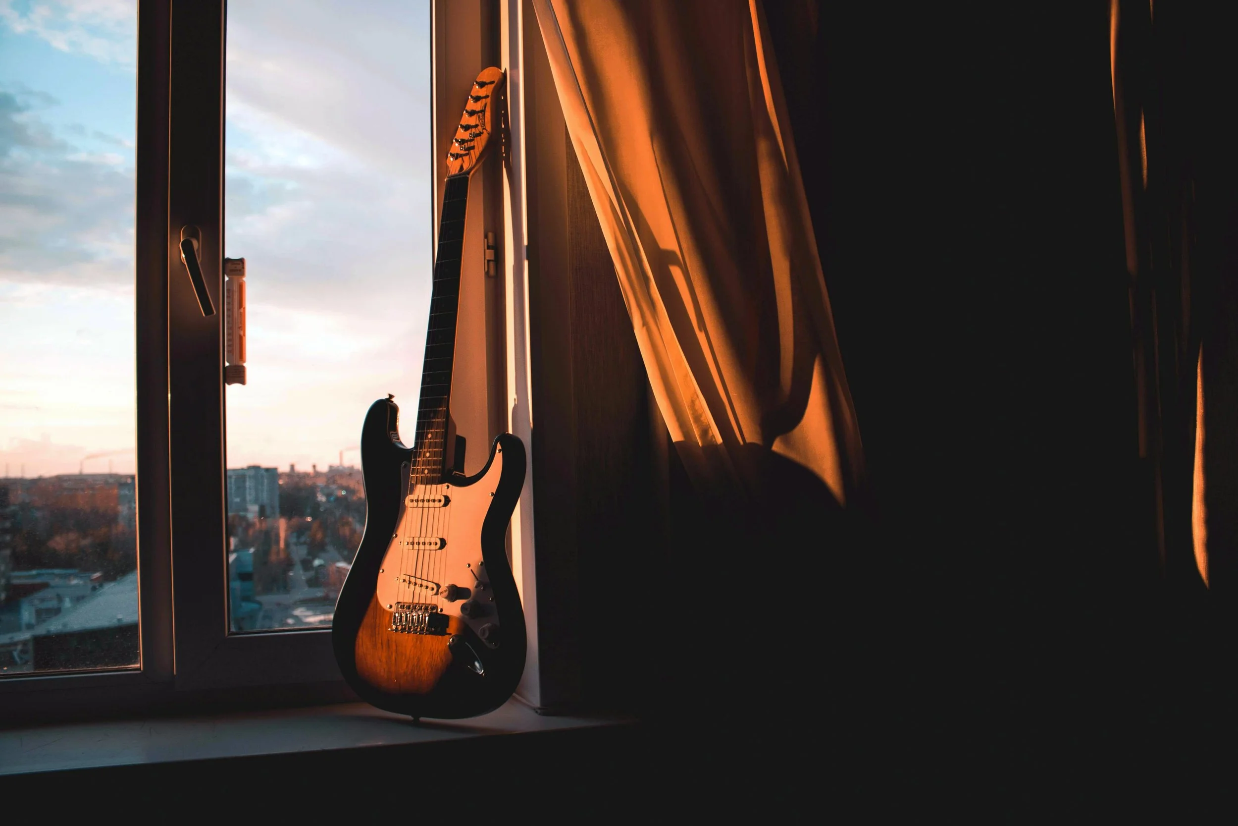 Guitar Beside Window