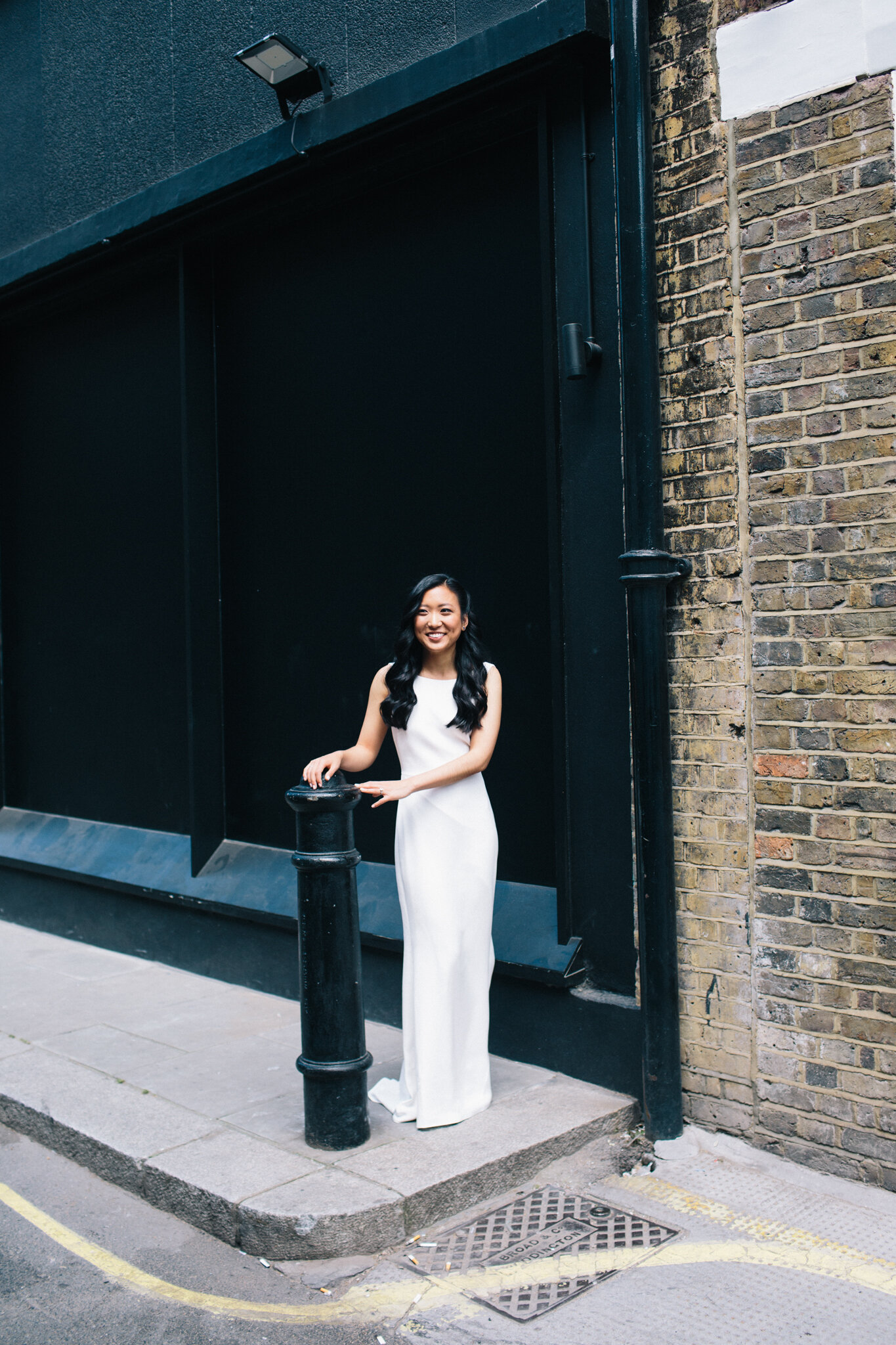 Bride in elegant wedding dress on a Soho street