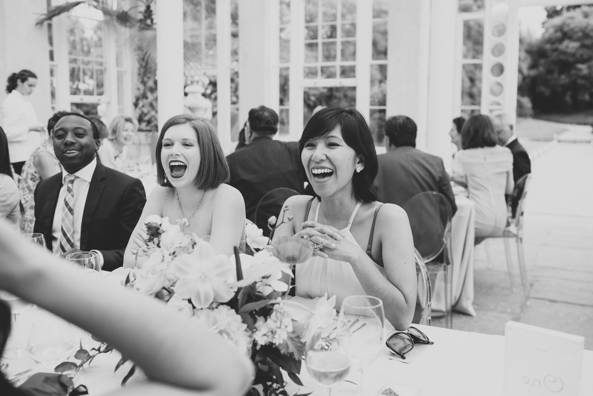 Guests laughing at a wedding at Syon Park