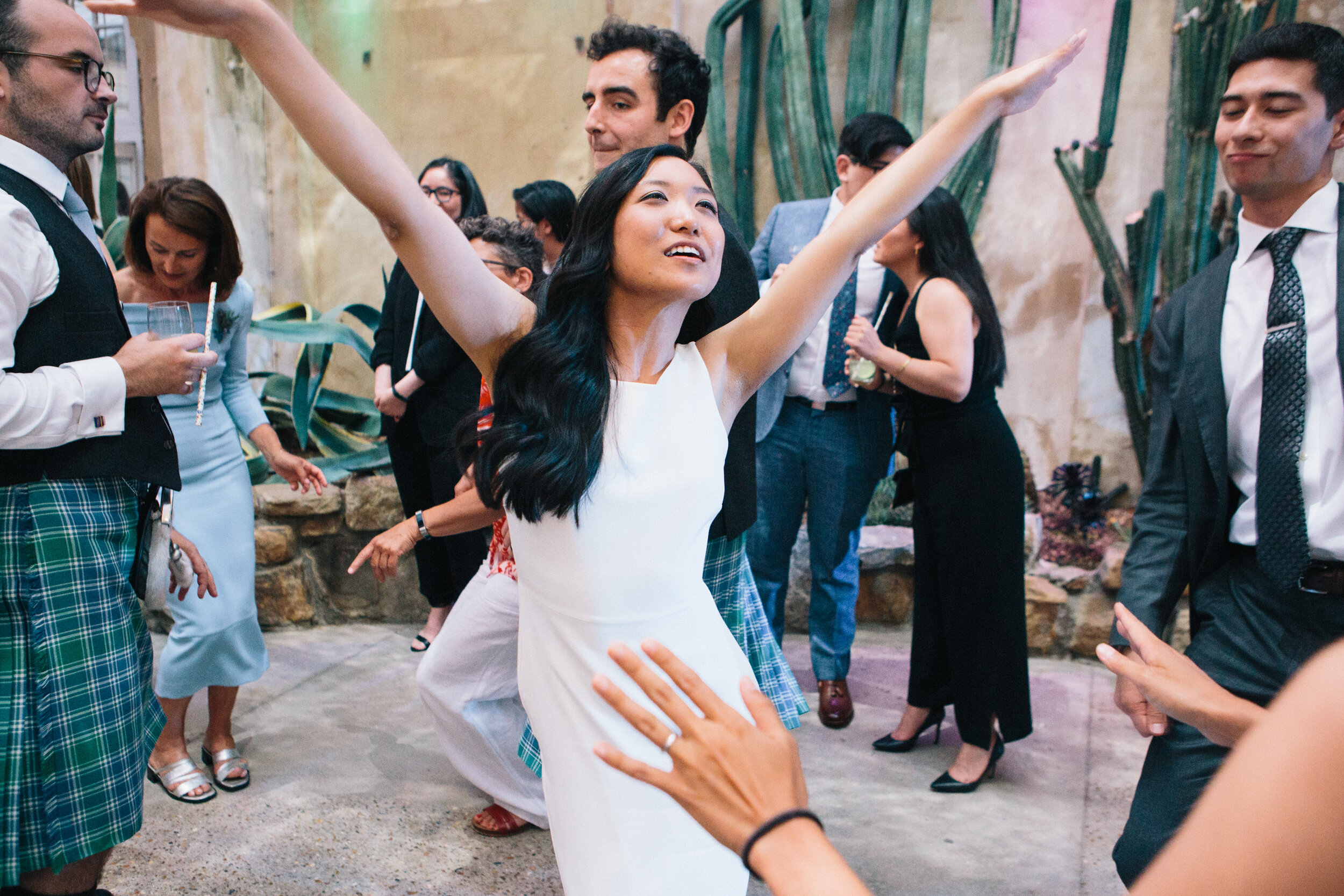 Bride in wedding dress dancing