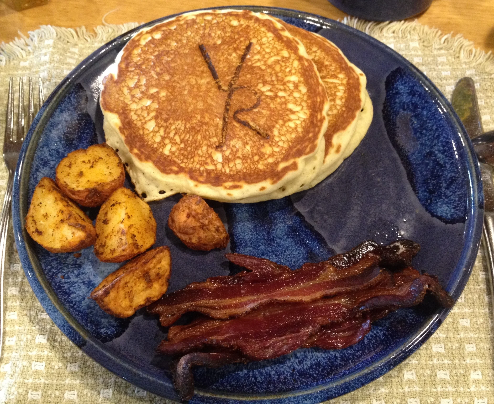 Vista Verde's homemade buttermilk pancakes are branded with its logo, and served with breakfast potatoes and the second-best bacon I've had in my life (if you're wondering, the best is at Peter Luger's in Brooklyn).