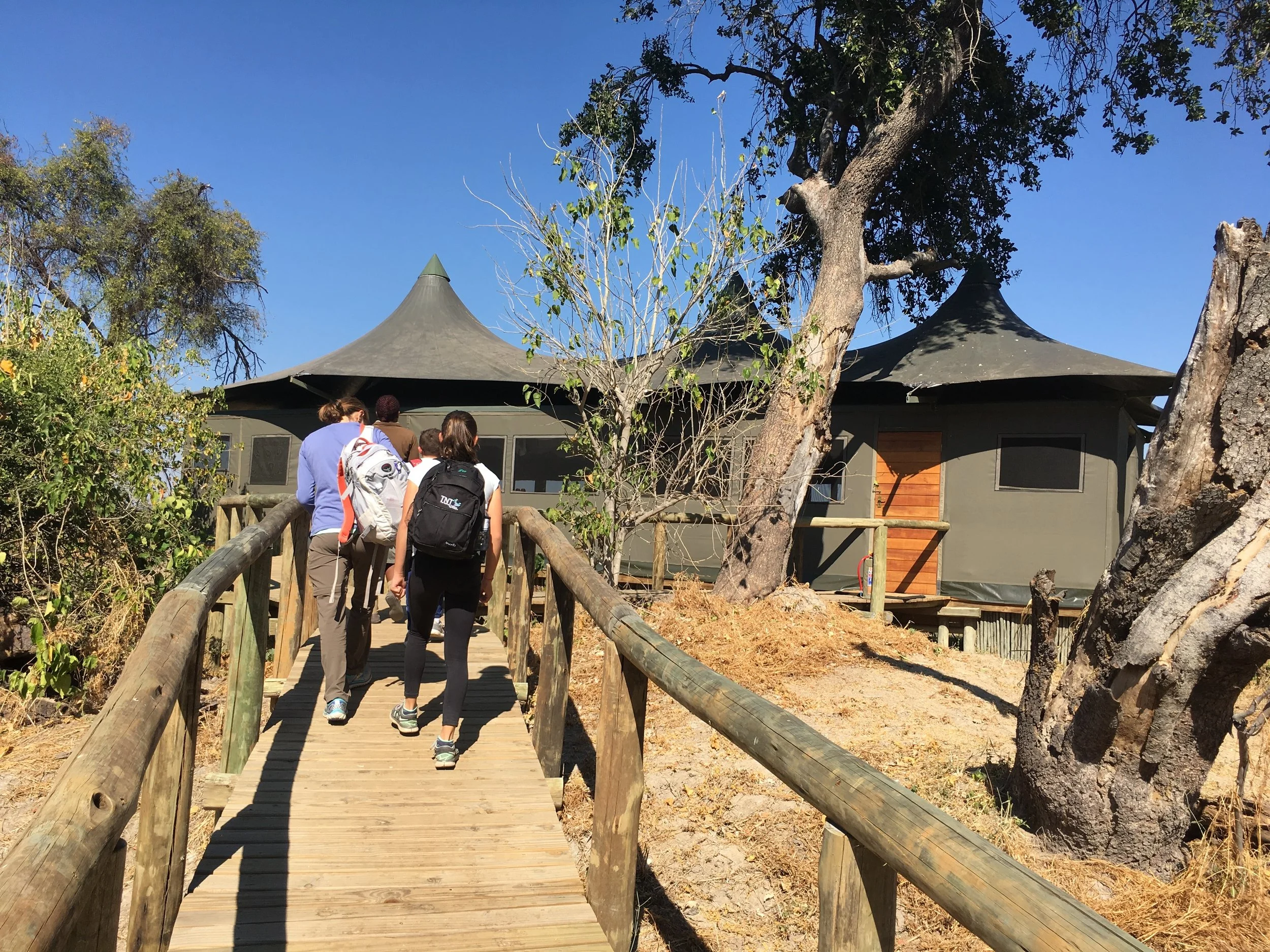 Walking to our family “tent” at Little Vuumbura, Okavango Delta, Botswana