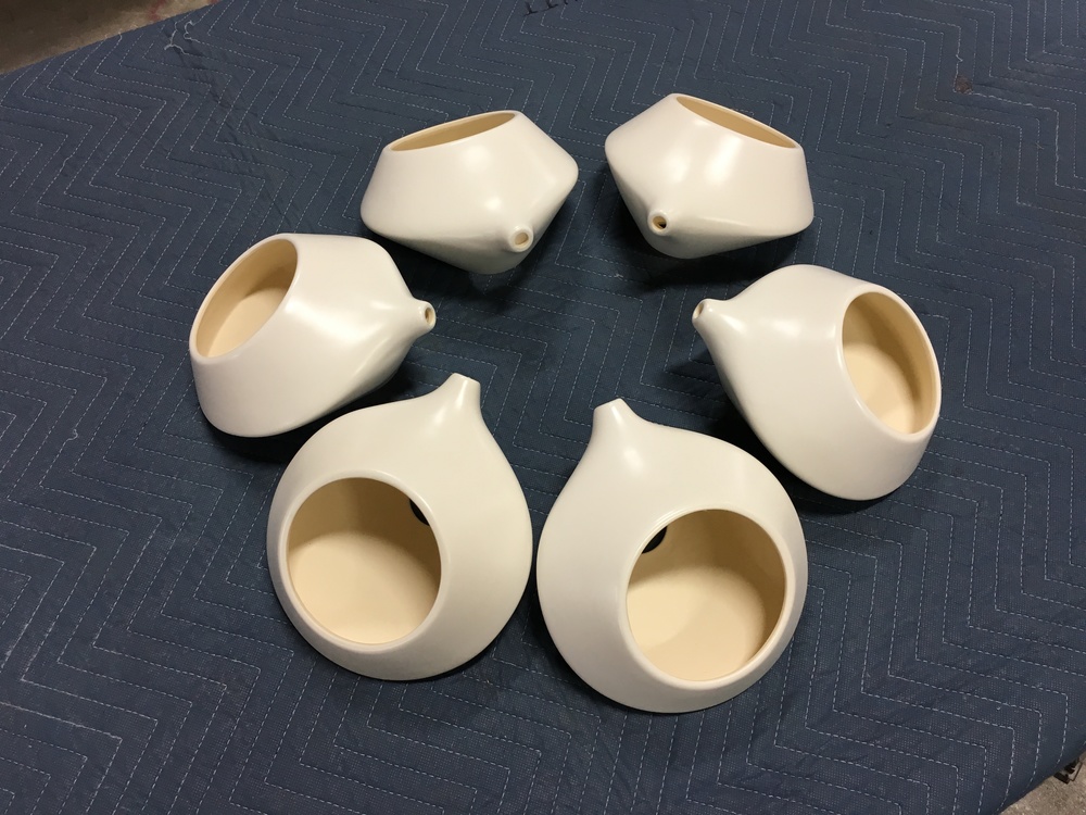 Slip-cast stoneware orbs in satin white glaze