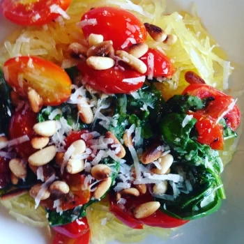 Spaghetti squash with tomatoes, spinach and pine nuts.
