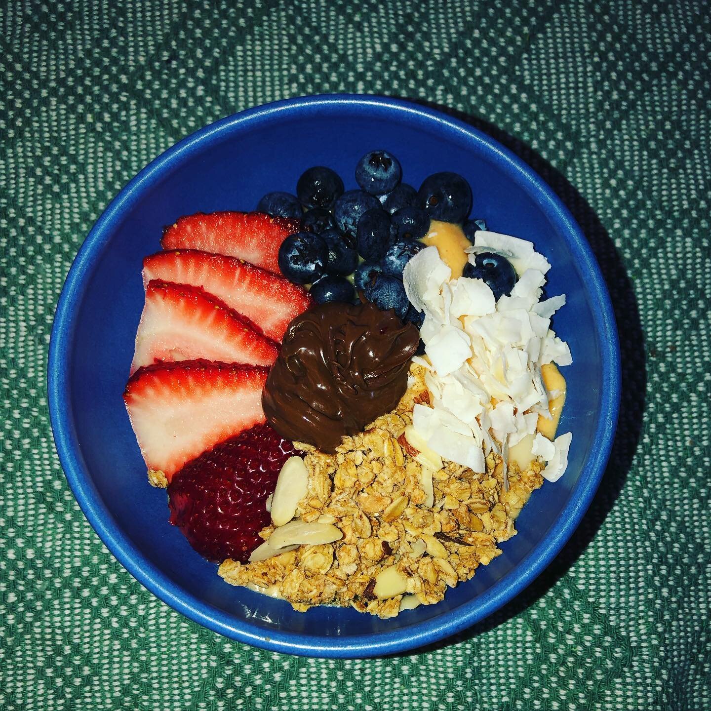 Tropical smoothie bowl for breakfast just what the birthday wished for. Frozen mango, pineapple, banana and coconut. Topped with strawberries, blueberries, granola, coconut and some Protinella.