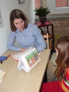Formally assessing receptive and expressive language skills.